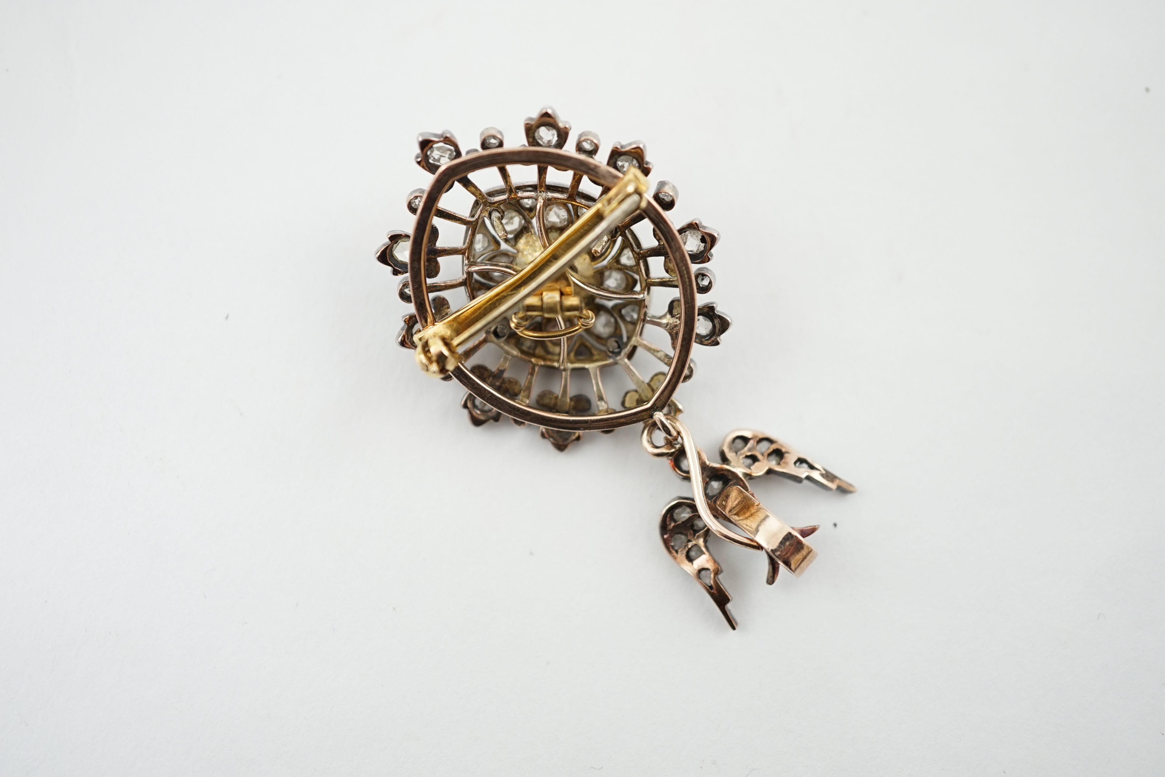 A Victorian gold, silver and diamond cluster set drop pendant brooch